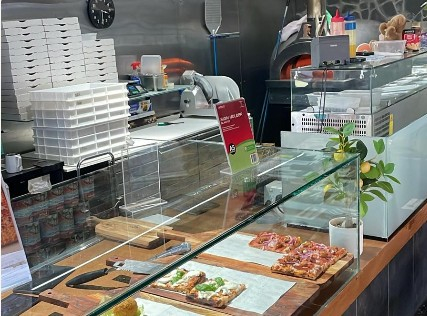 Maurizio Pizzeria pizza counter